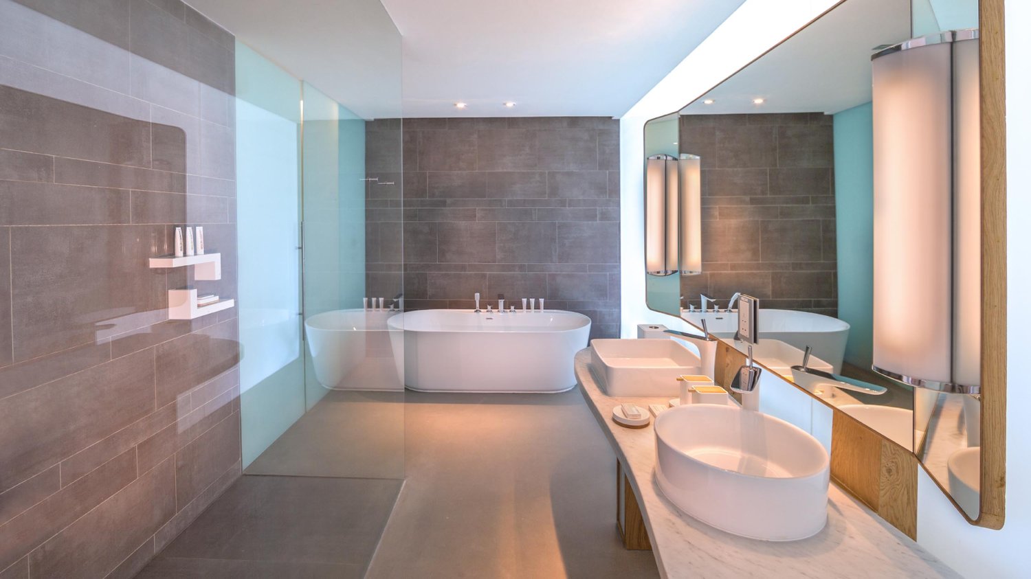 Large bathroom with walk in shower, bath tub and his and hers basins