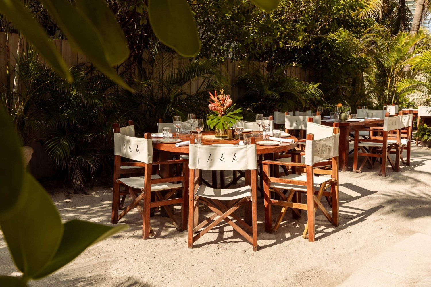 Outdoor seating area on the sand for dining at nikki beach