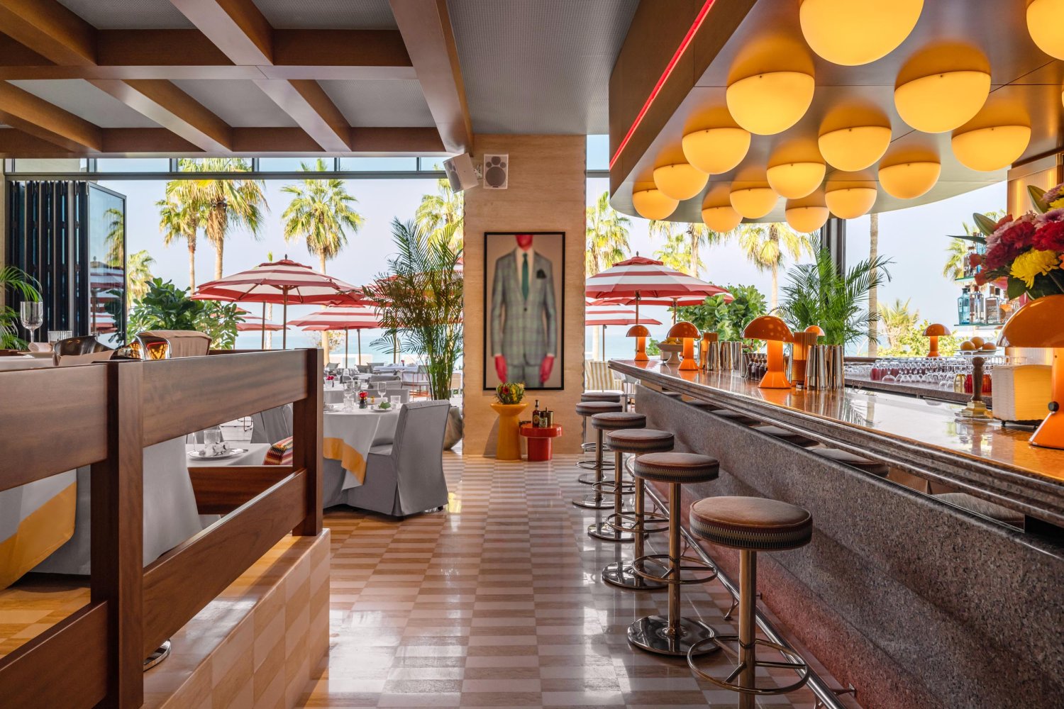 Bungalo34 interior showing bar with bar stools and dining area