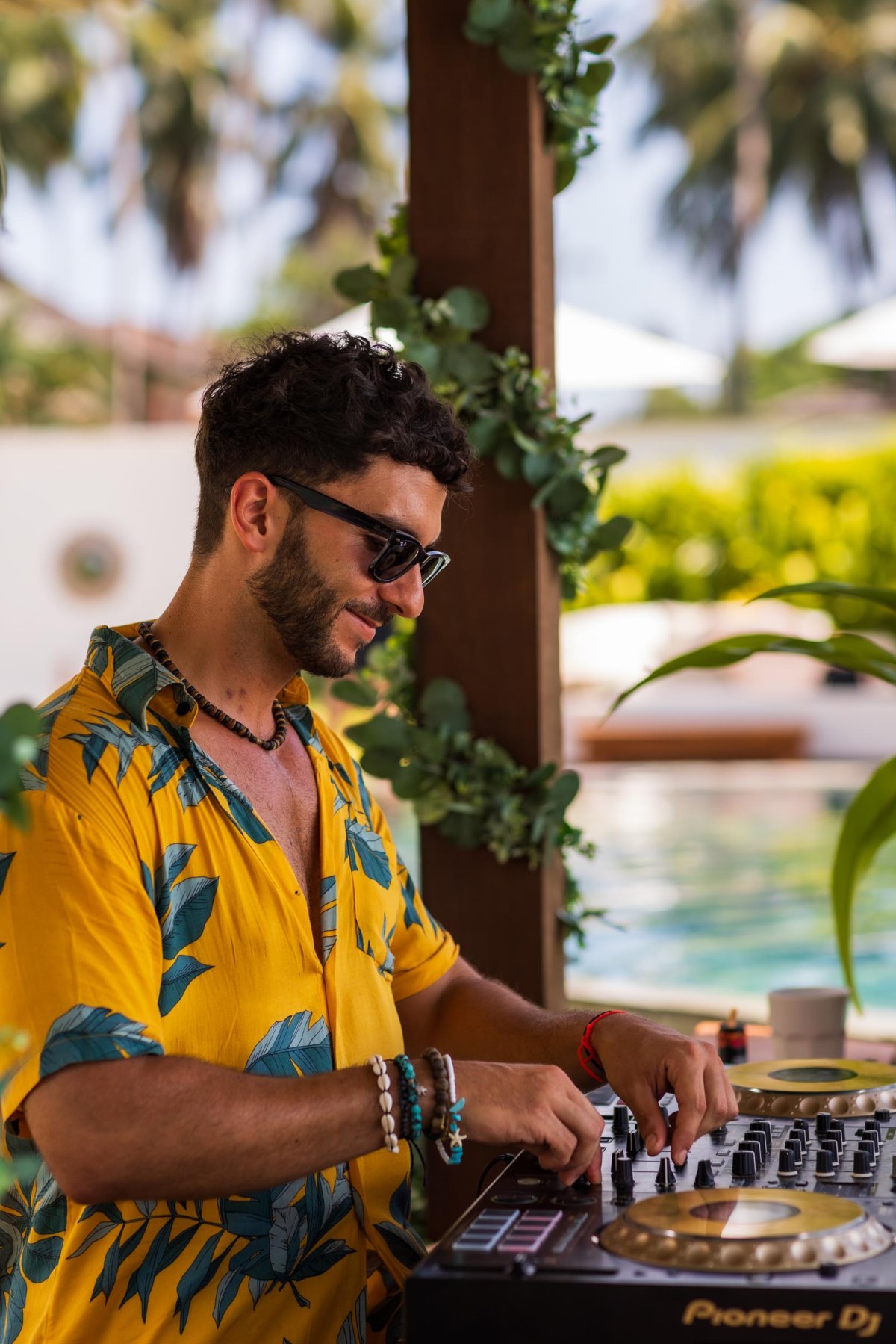 DJ playing on mixing decks
