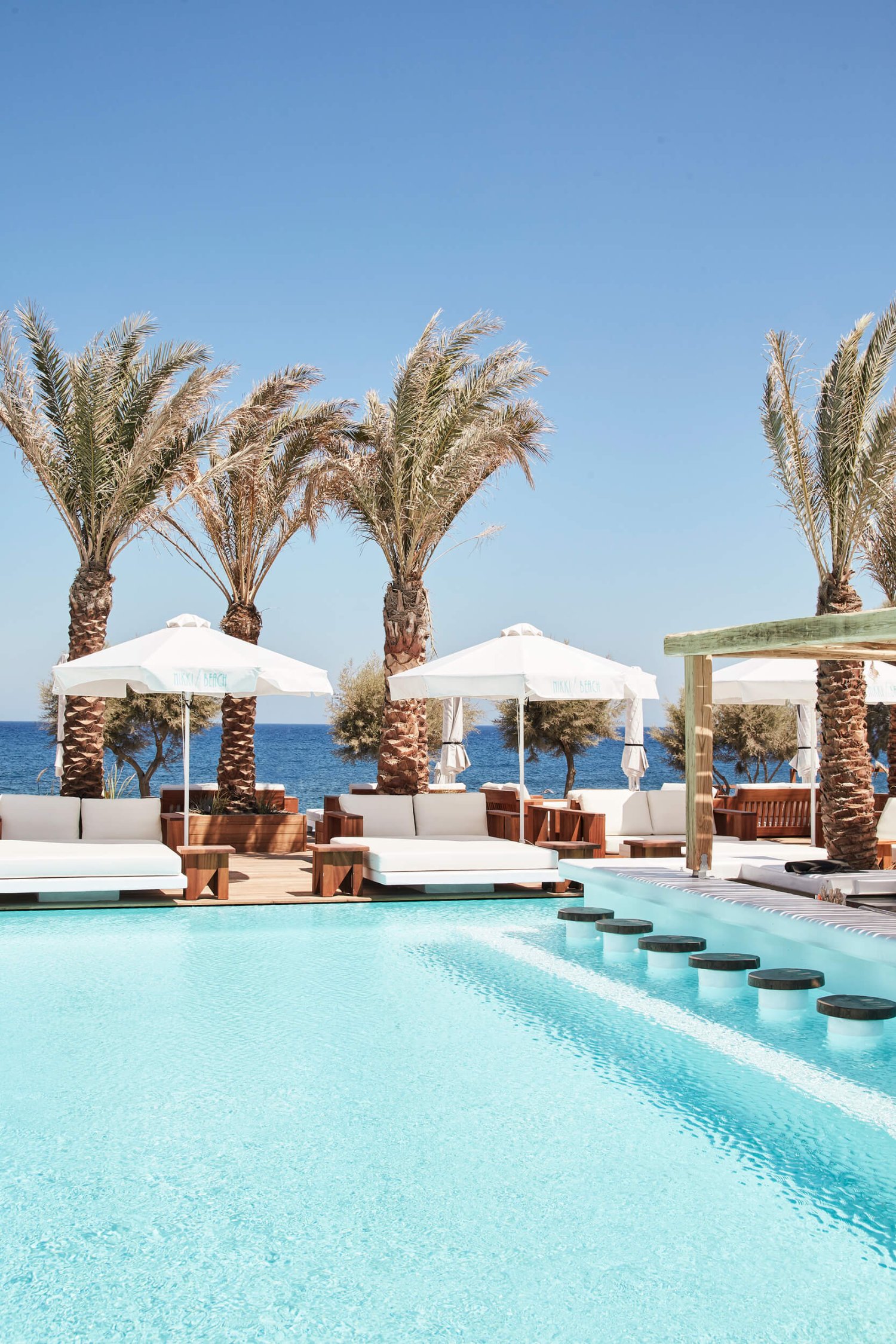 Portrait shot of the resort pool at Nikki Beach Santorini