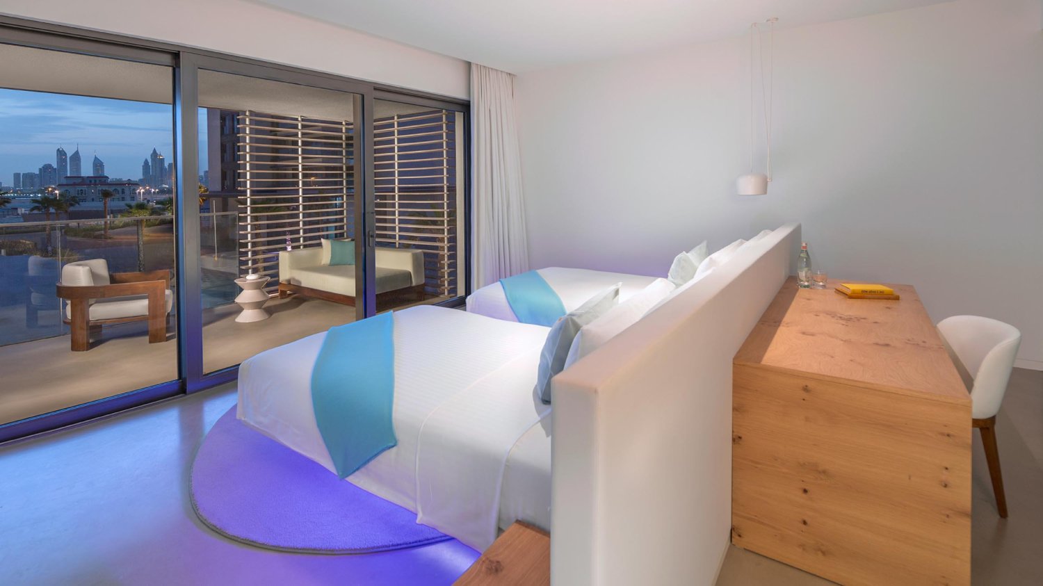 Two single beds, dressing table and the skyline view balcony