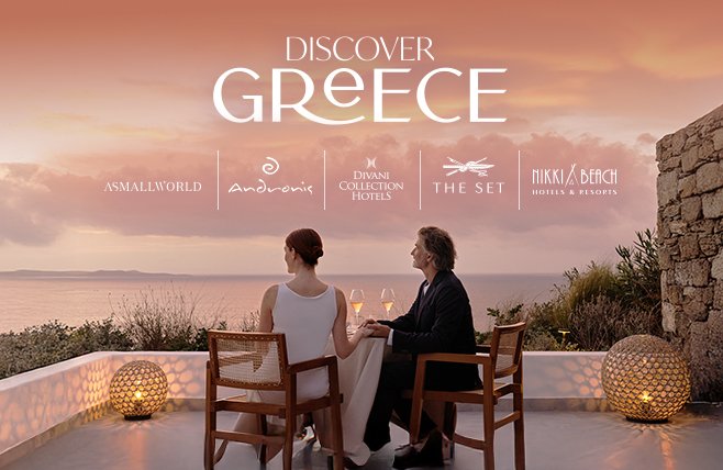 A couple sits together at an elegant outdoor dining table on a terrace overlooking a calm sea at sunset, illuminated by glowing, spherical floor lamps. The graphic includes the prominent text 