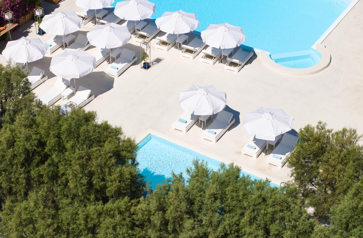 Nikki Beach Santorini Exterior showing sun loungers, umbrellas and pool areas