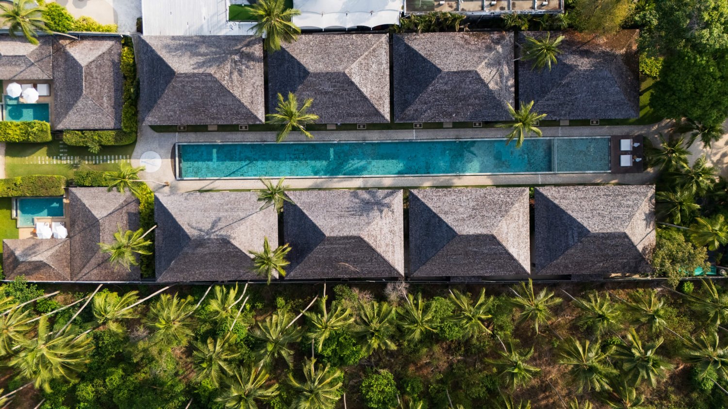 Drone shot of the accommodation and pool at Nikki Beach Koh Samui