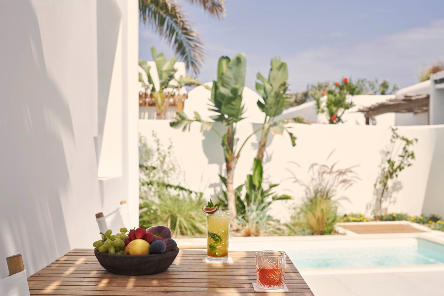 Luxury Suite with Private Pool, pool area with cocktails, table and chairs