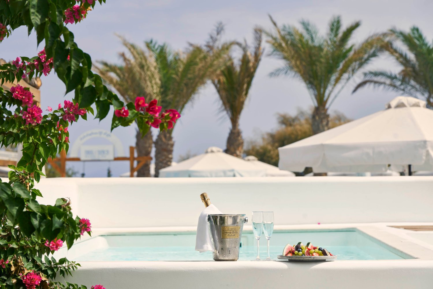 Luxury Suite with Private Pool, pool area with wine bucket, champagne flutes and a fruit platter