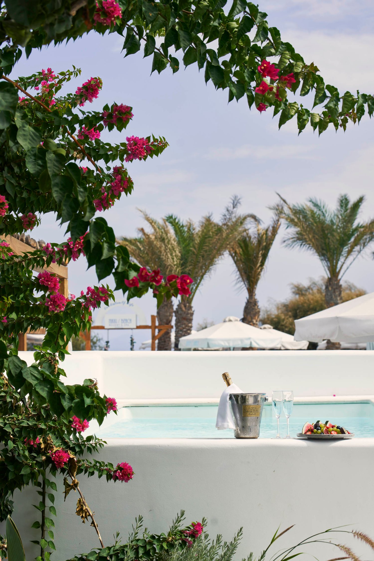 Private Pool area with wine bucket, champagne flutes and a fruit platter