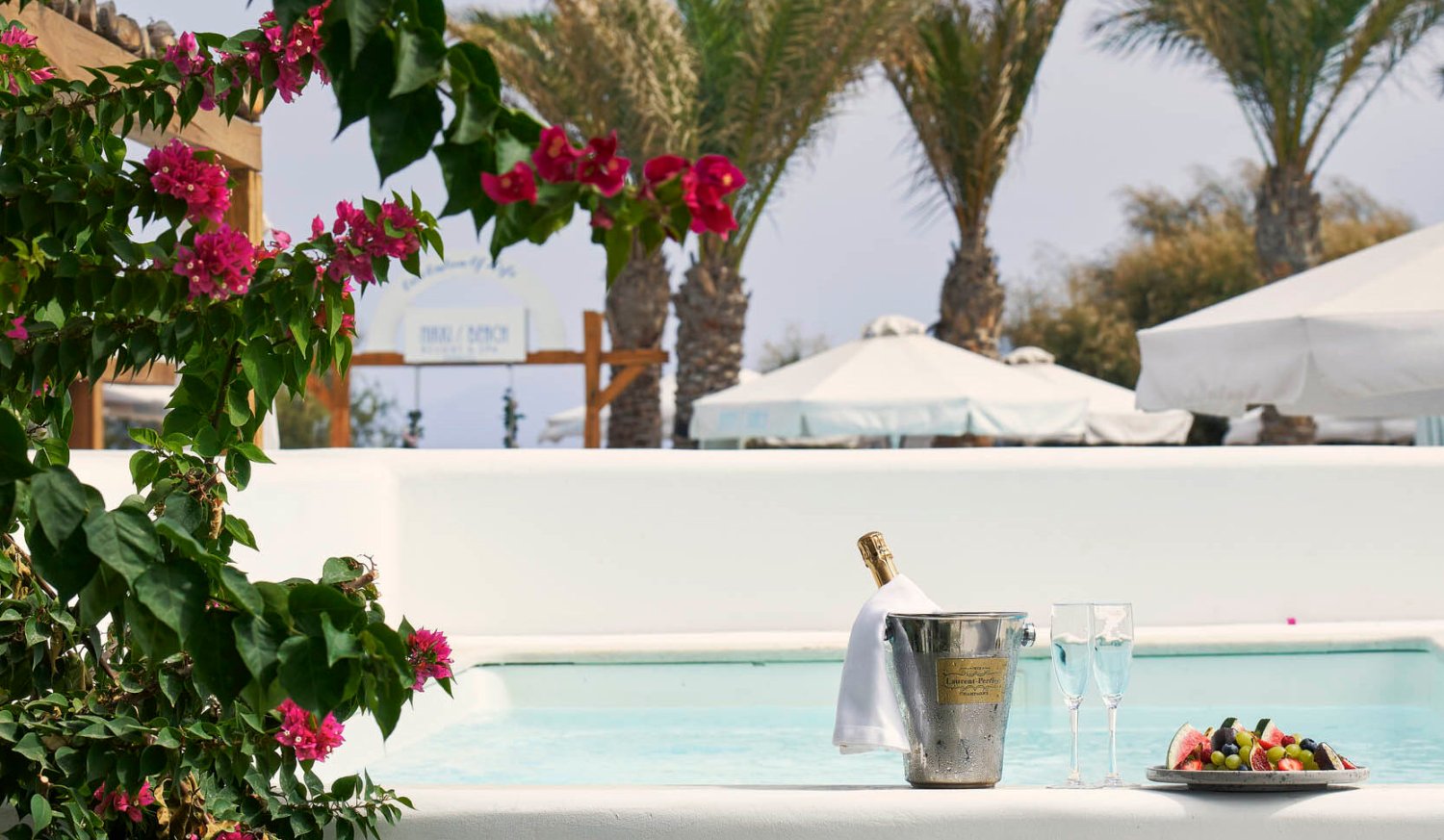 Luxury Suite with Private Pool, pool area with wine bucket, champagne flutes and a fruit platter