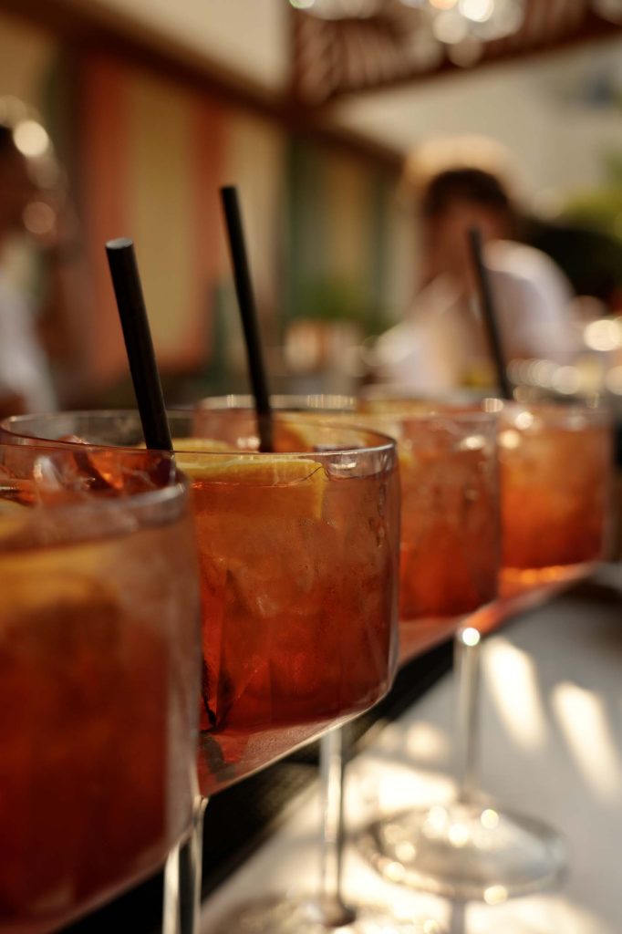 Row of cocktails lined up on a table