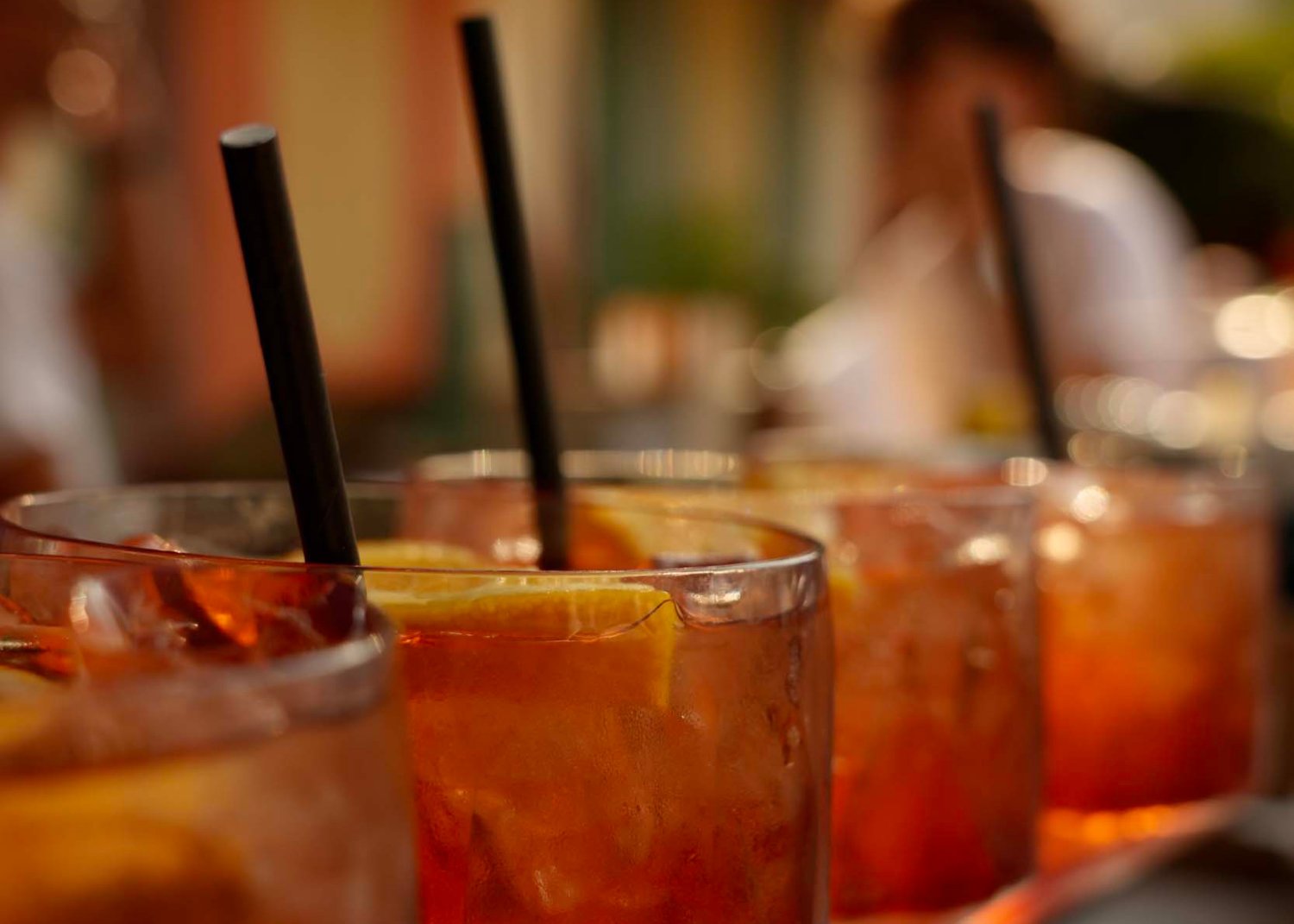 Row of cocktails lined up on a table