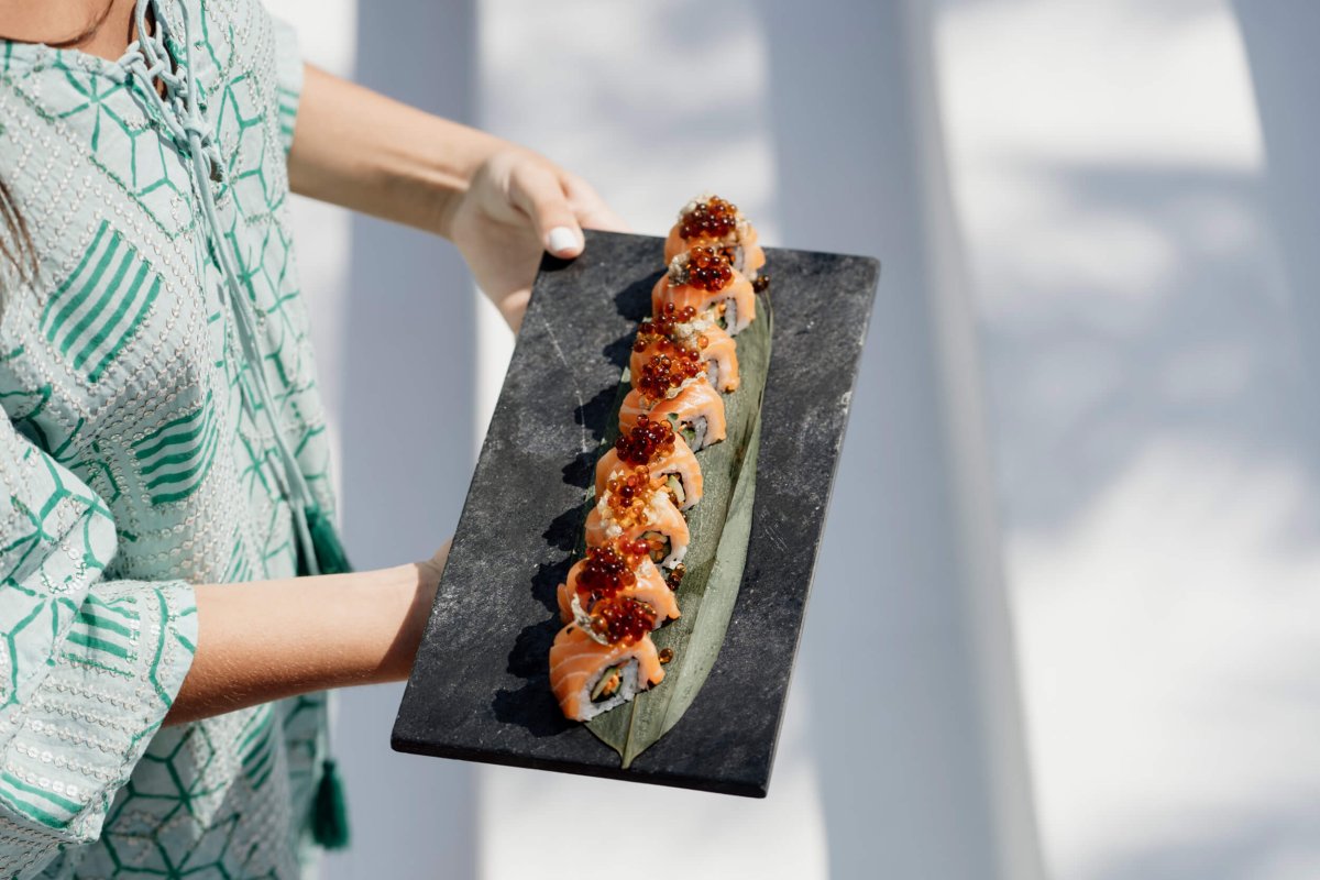 Waiter holding a sushi platter