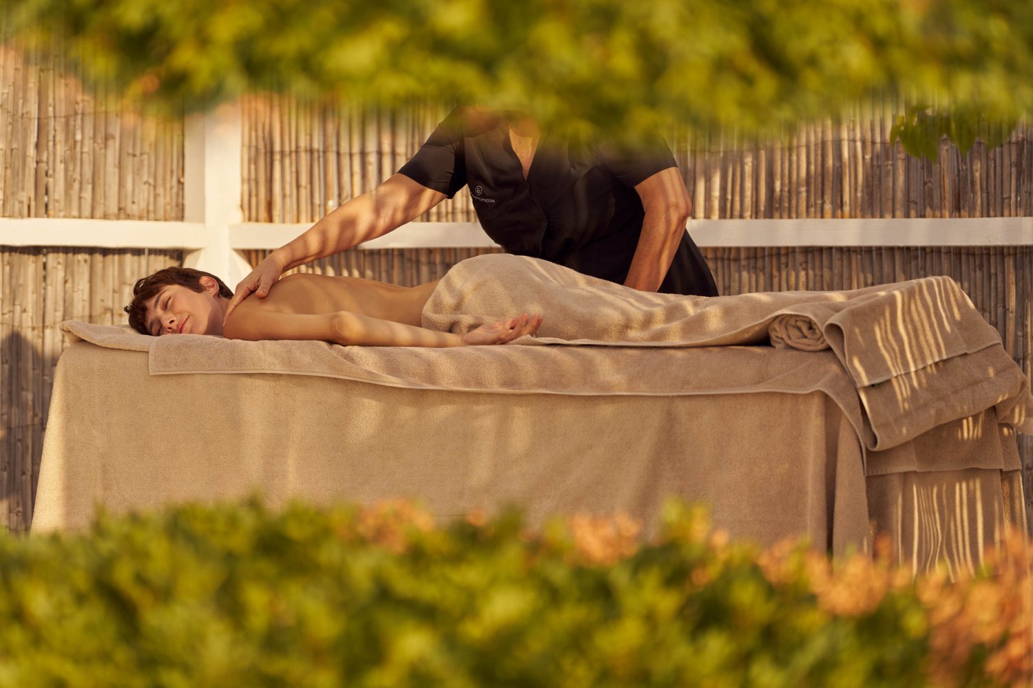 Nikki Beach Porto Heli - Lady getting a massage by a masseuse