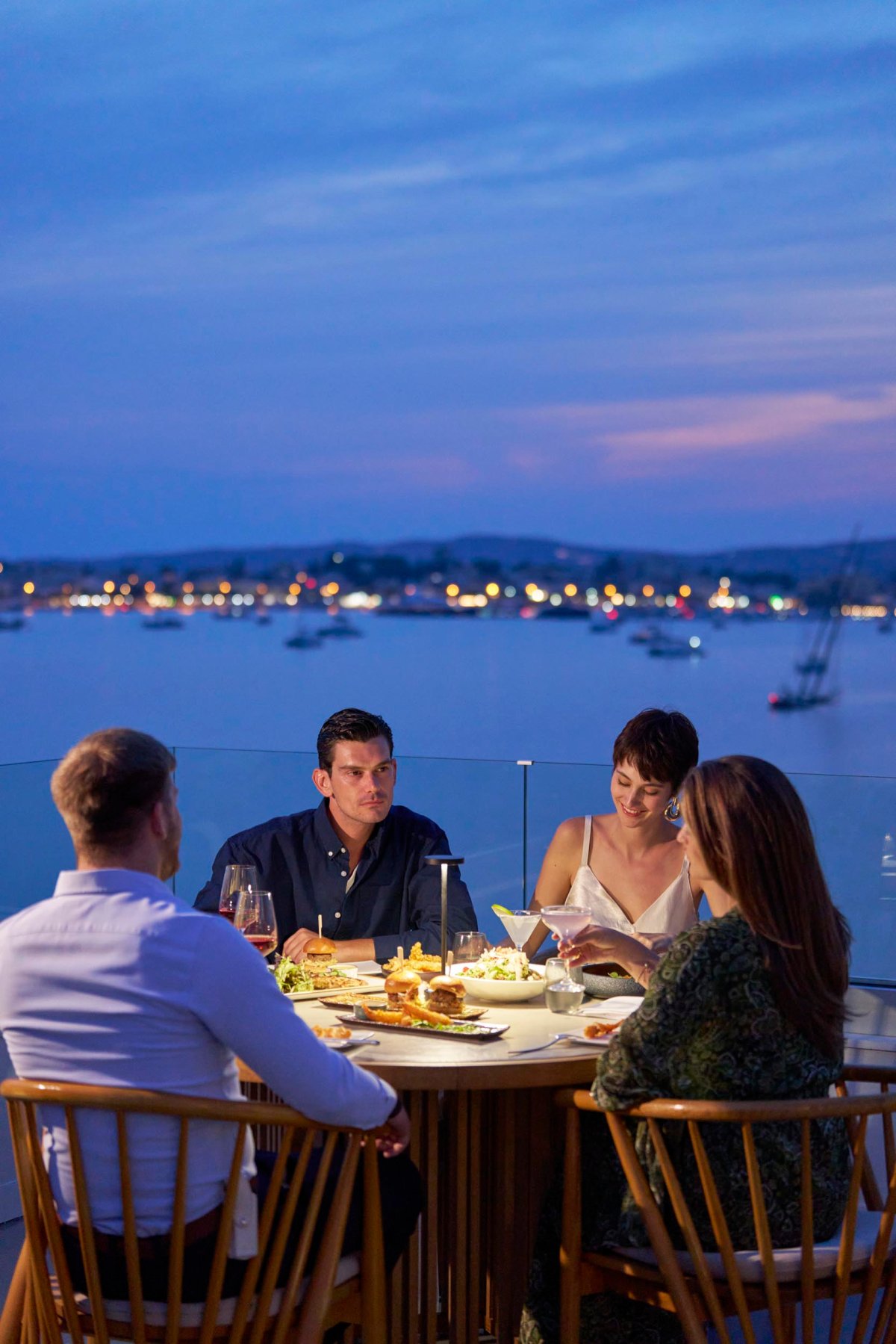 A group of people enjoying an evening meal