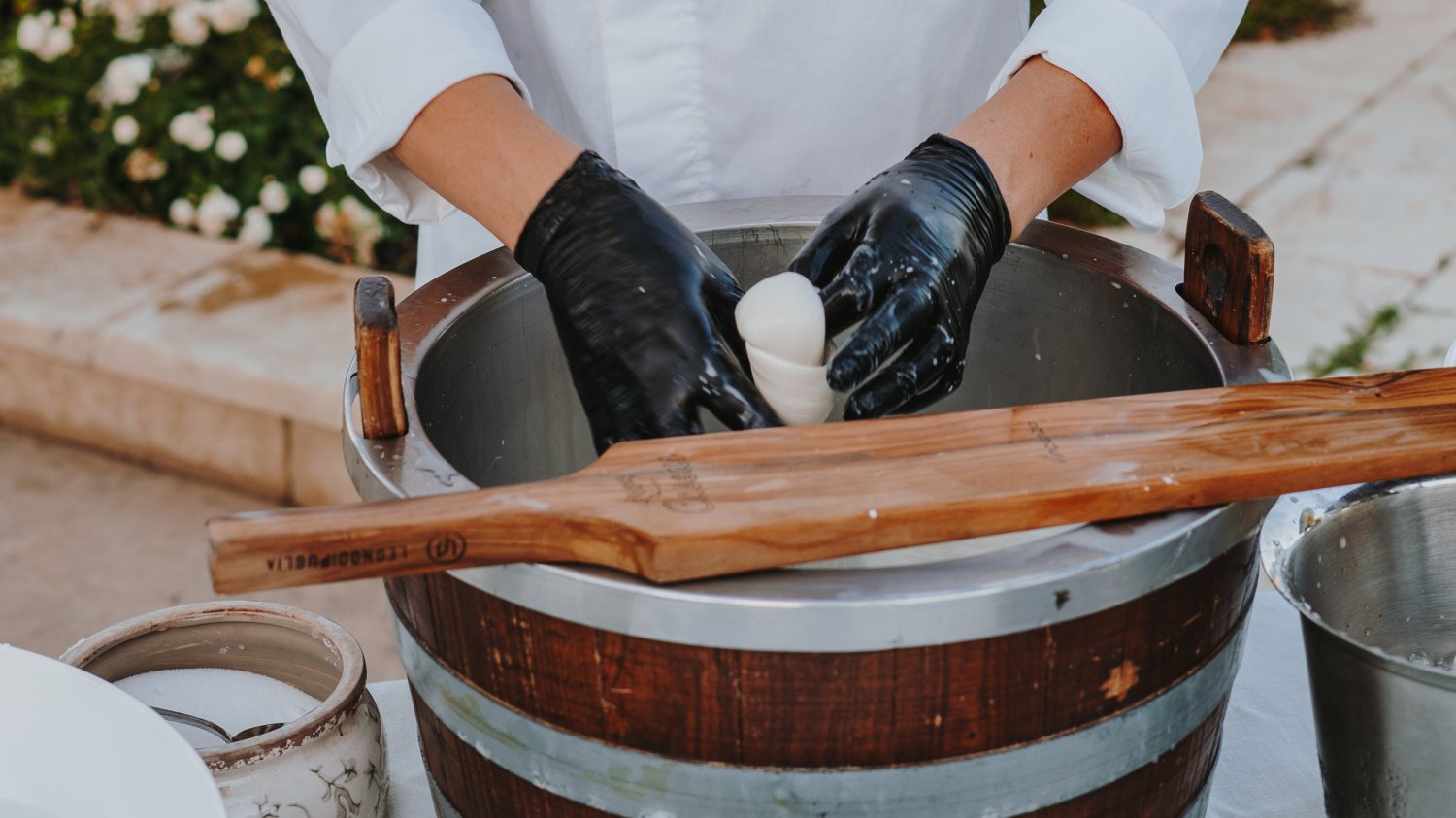 Chef making food in a large mixing bowl