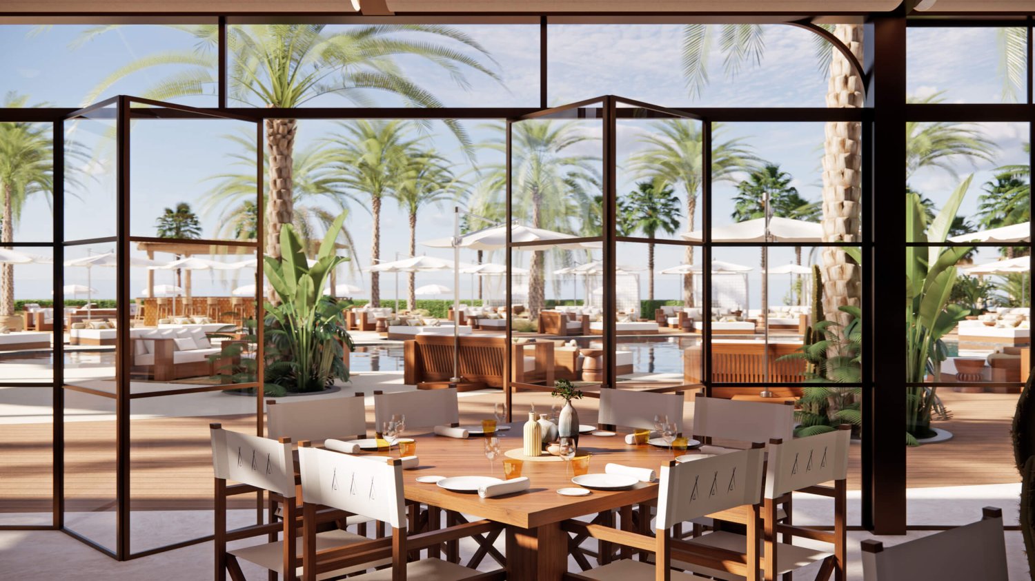 Nikki Beach dining table seating 8 people, floor to ceiling windows open out to the outdoor pool dining area