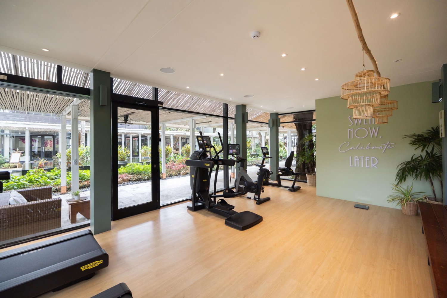 Tone gym interior showing running machine and stair master