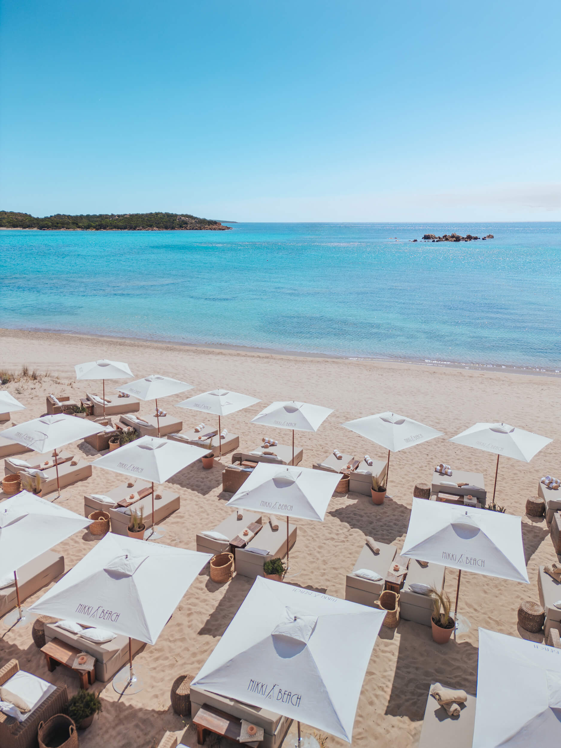 Nikki Beach Costa Smeralda Beach shot with sun loungers and the sea in the background