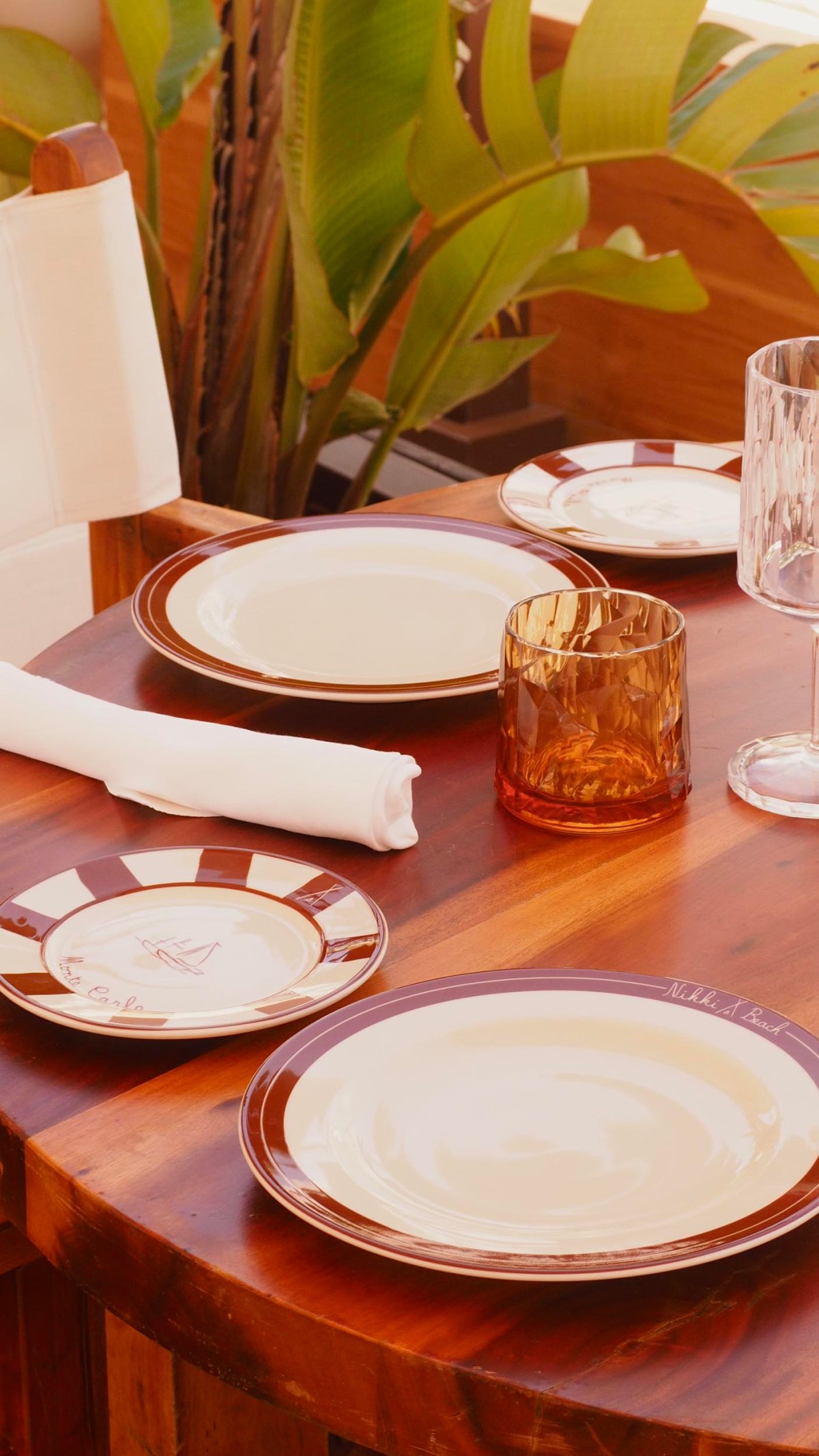A table set with plates, cutlery and glasses