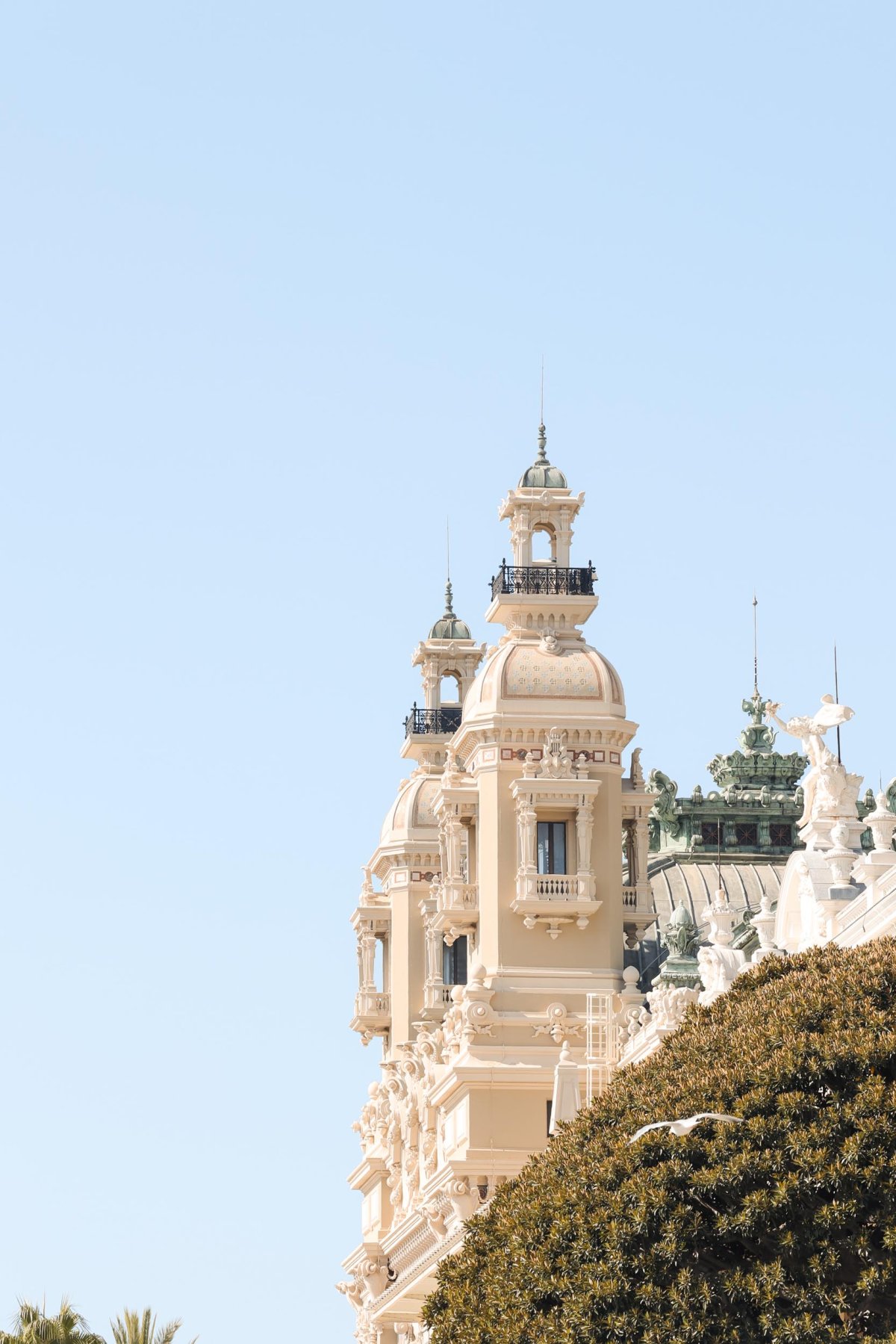 Intricate details of a rooftop in front of a clear blue sky