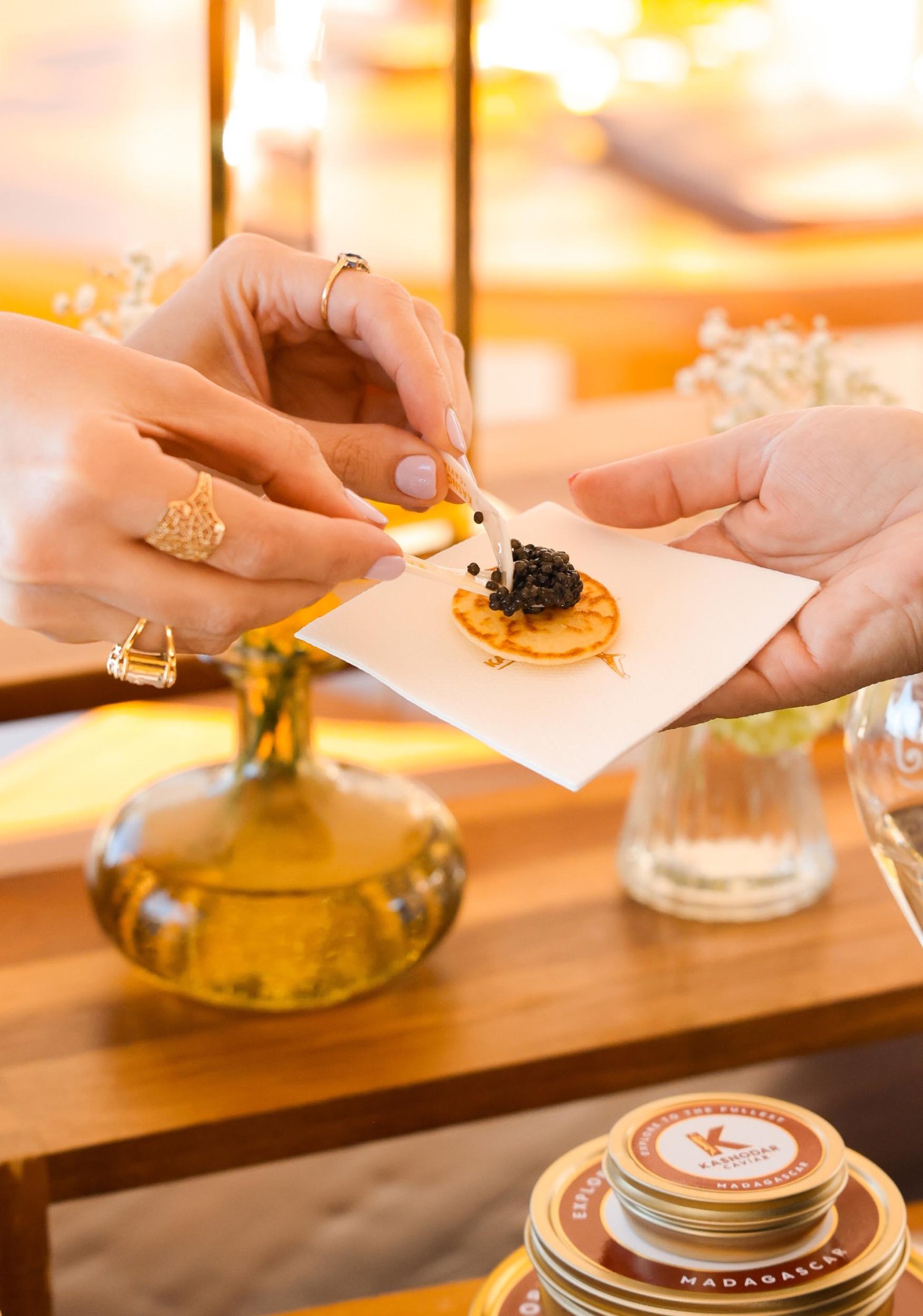 A person serving caviar