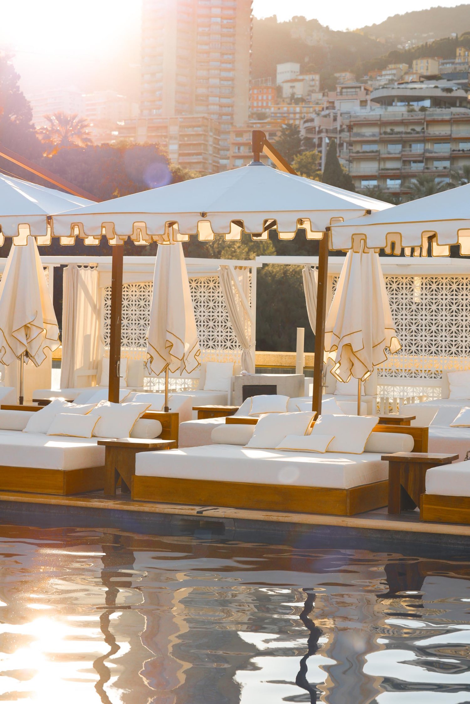 Sun loungers and parasols by the edge of the pools