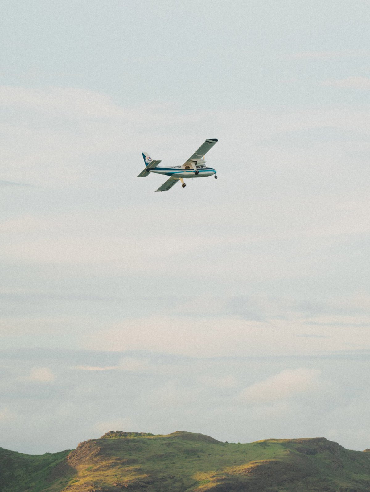 Plane flying over the shoreline