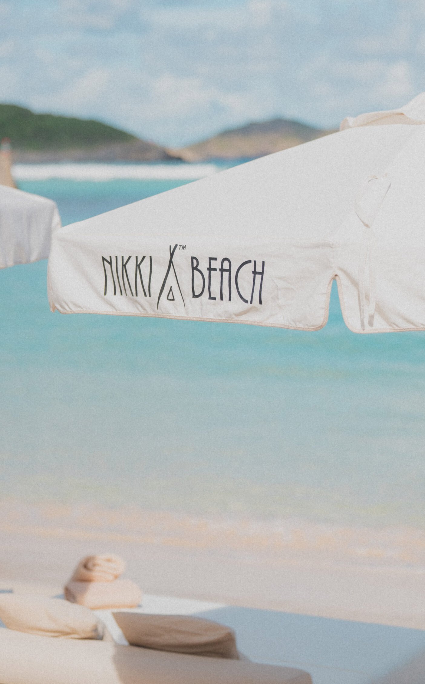 Nikki Beach branded umbrella on the beachfront