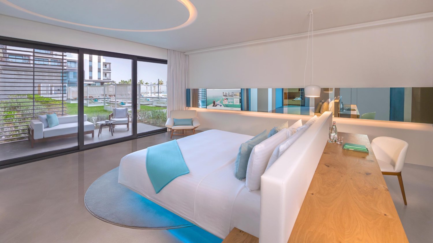 King sized bed looking out to private terrace
