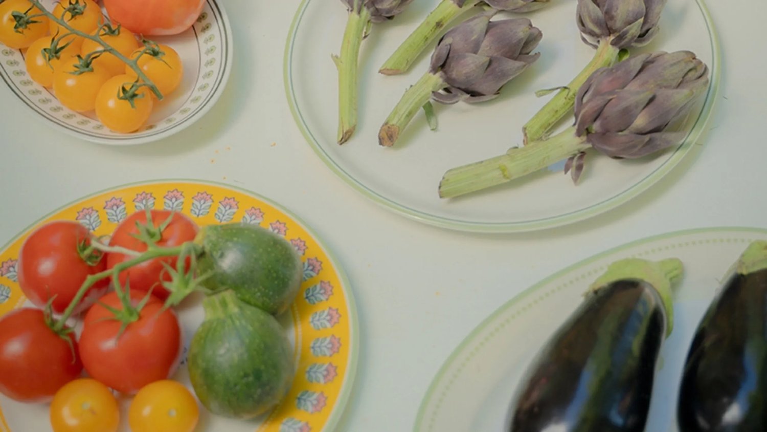 A beautifully arranged table showcasing an array of fresh, vibrant vegetables, embodying the essence of Provence's culinary charm