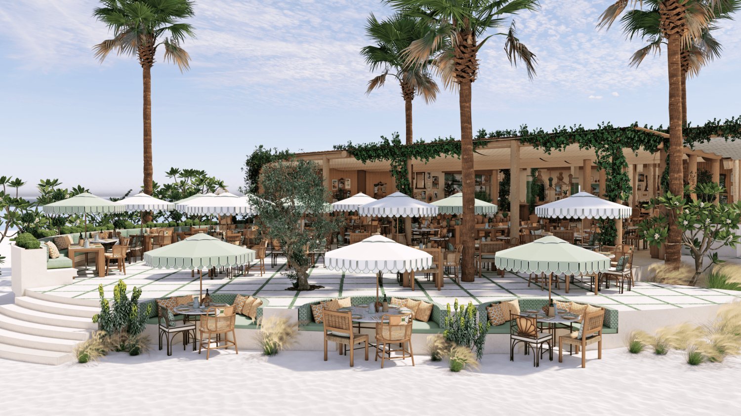Beachside restaurant with palm trees and umbrellas, embodying elegance and warmth at Nikki Beach Resort & Spa Dubai