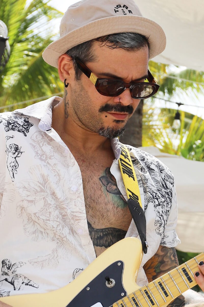 Close up shot of a man playing electric guitar