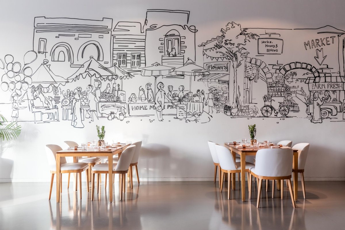 Soul lounge dining tables with a sketched art wall design