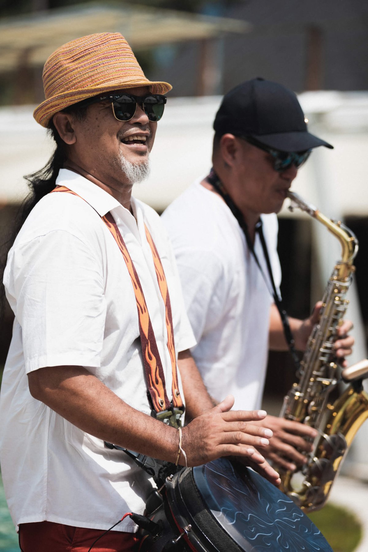 Musicians playing the saxophone and drum