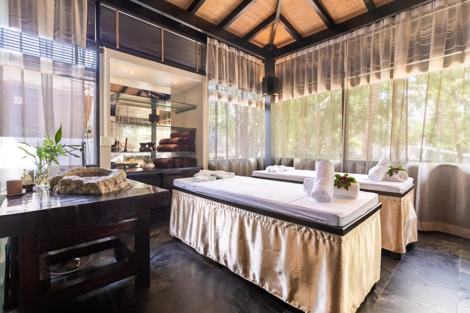 Wide shot of the interior spa beds at Nikki Beach Koh Samui