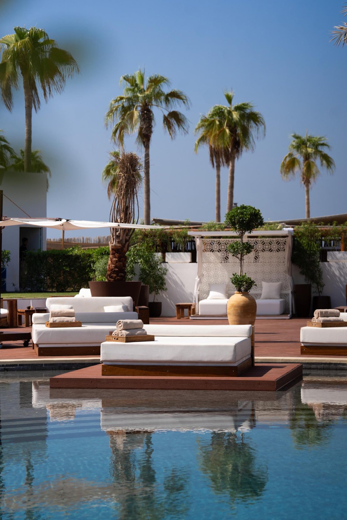 Sun beds on the edge of a pool