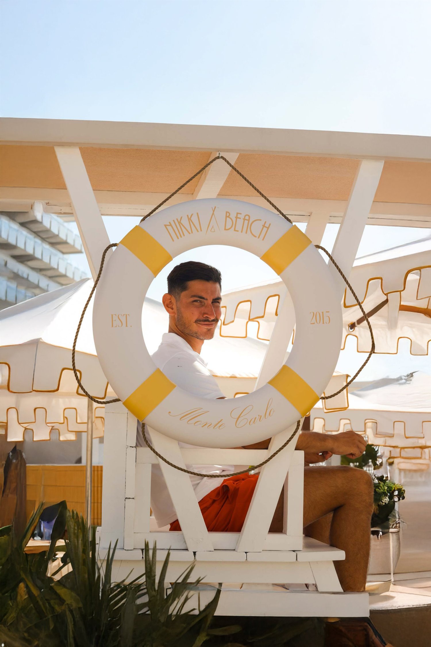 Our lifeguard stands watch beneath the iconic yellow and white of Nikki Beach Monte Carlo — the ultimate symbol of Riviera elegance since 2015