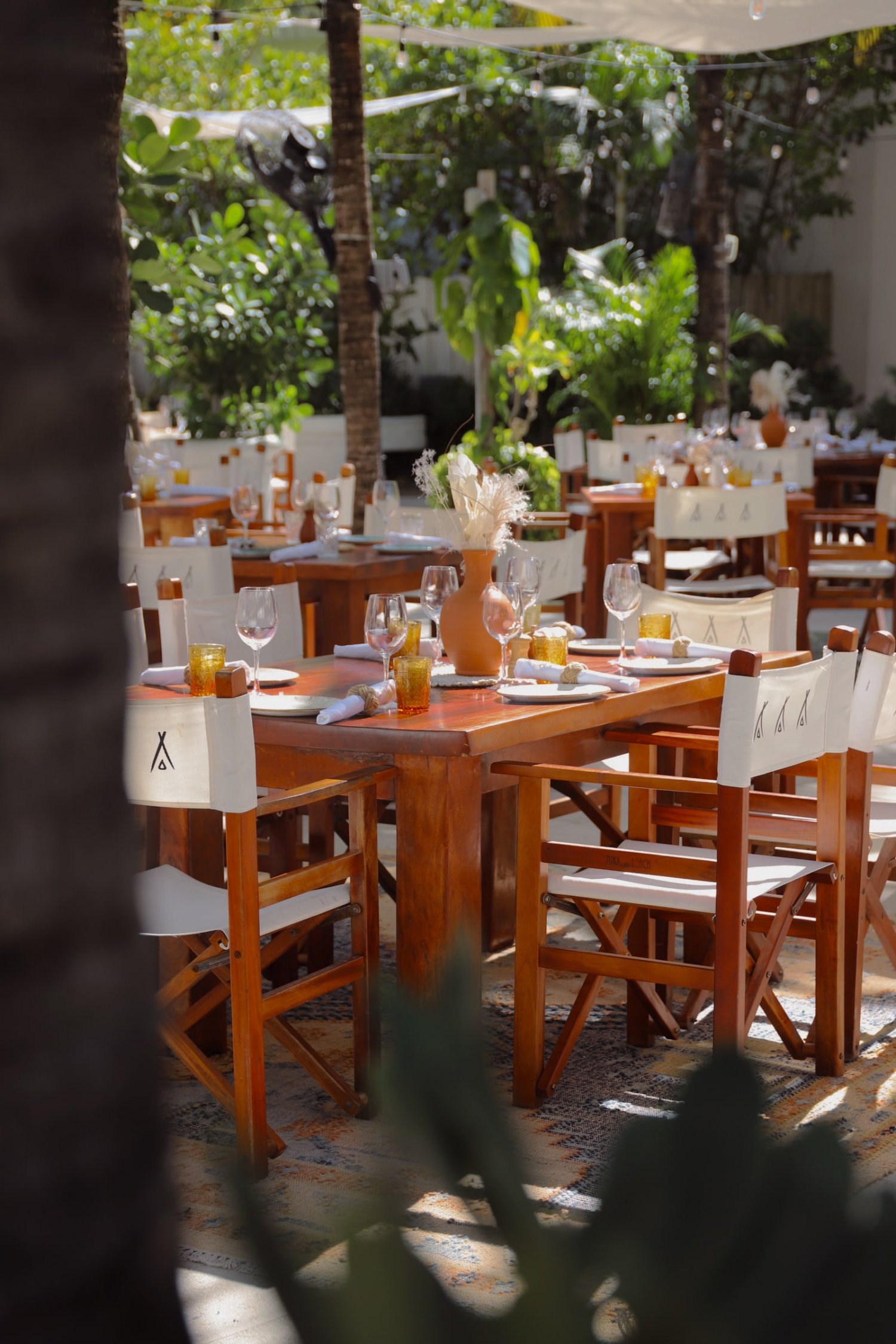 A refined table set with white chairs, creating a chic and stylish space perfect for gatherings