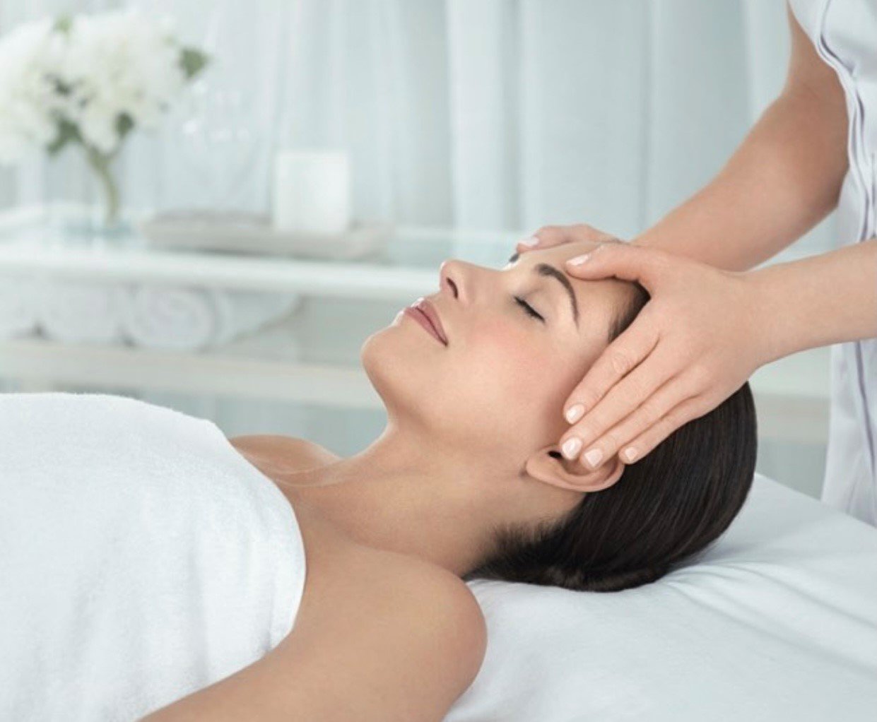 A lady getting a facial massage