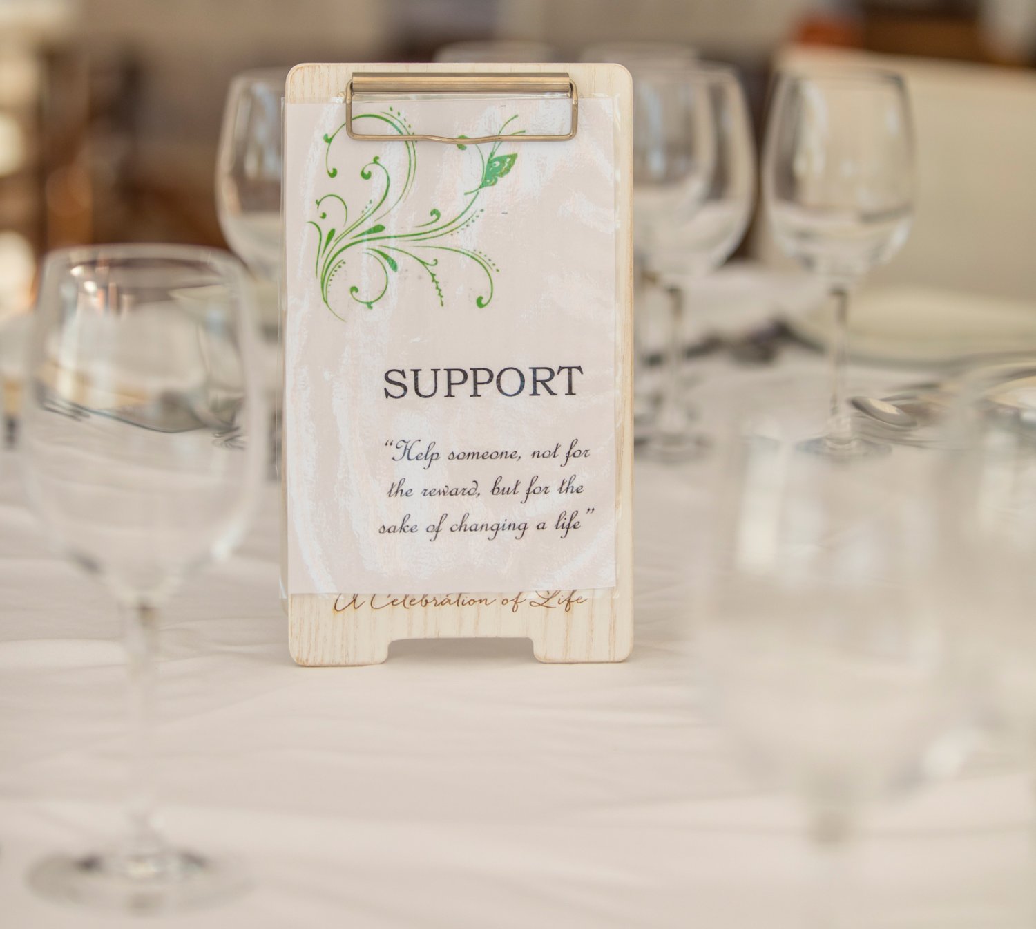 A teepee table stand notice stating - 
