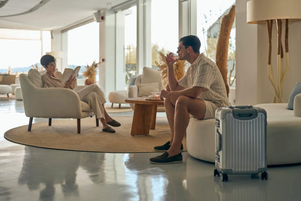 A man and women sitting relaxing in the Nikki Beach lobby