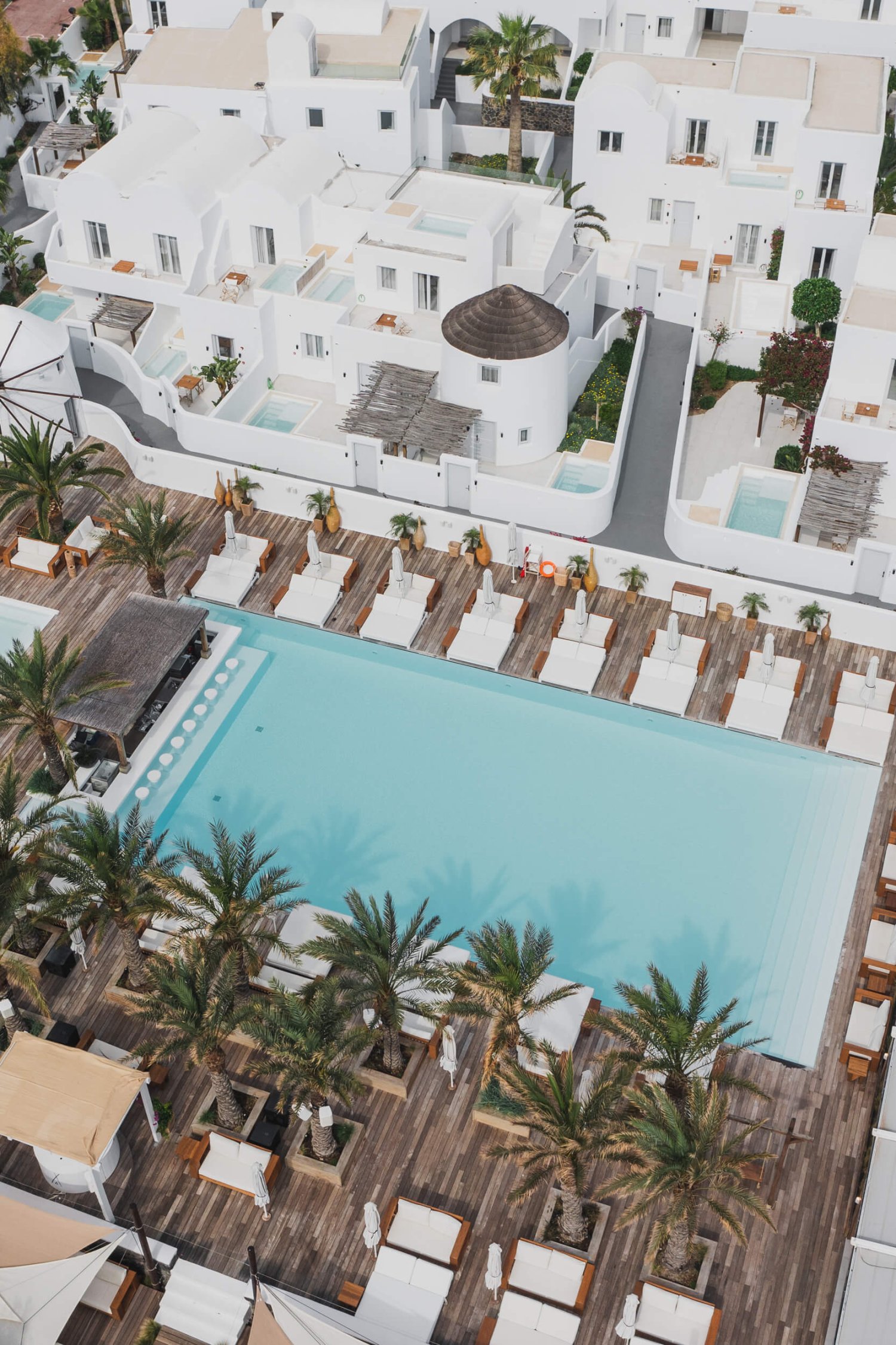 Drone shot of the resort pool and accommodation at Nikki Beach Santorini