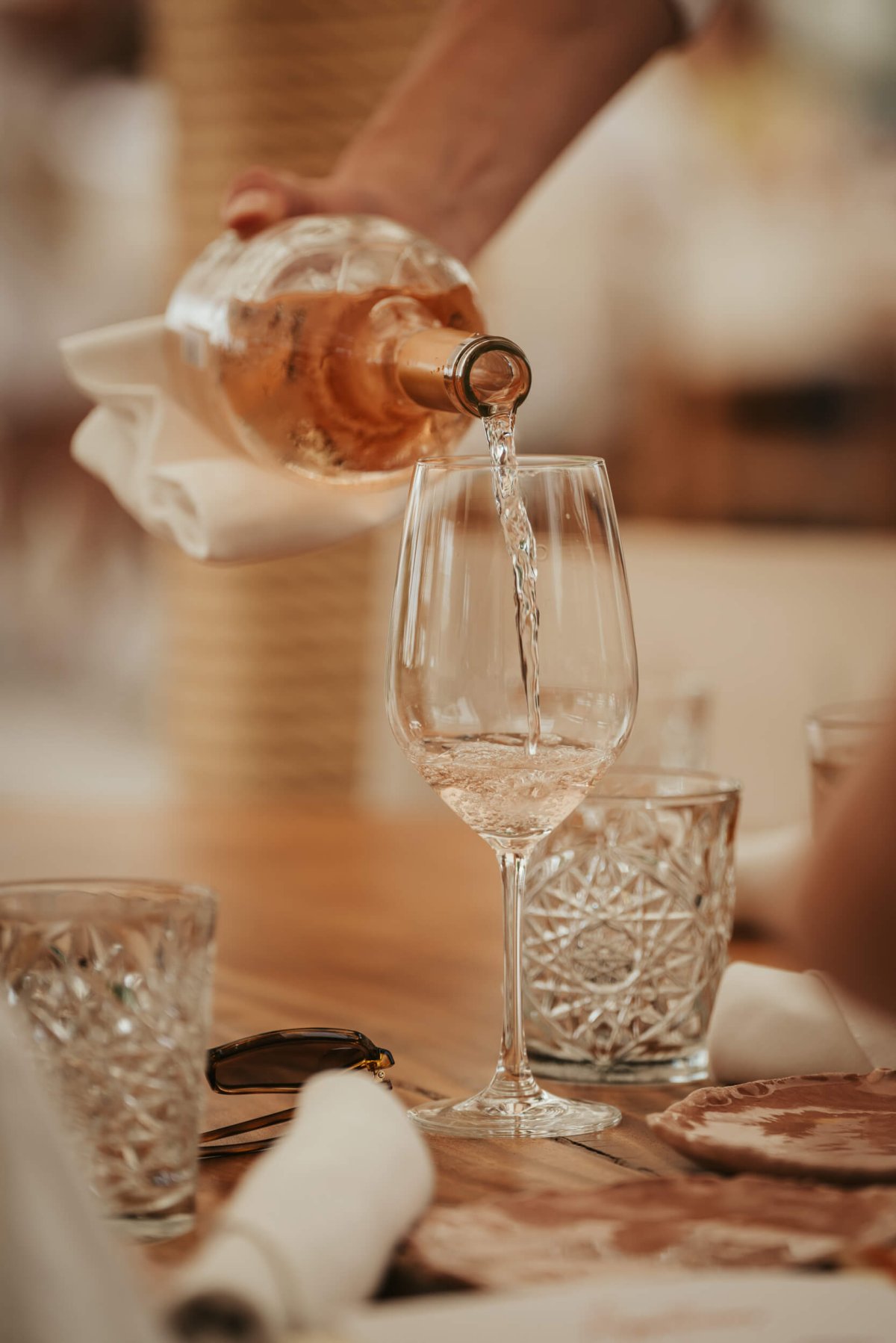 Glass of wine being poured from a bottle