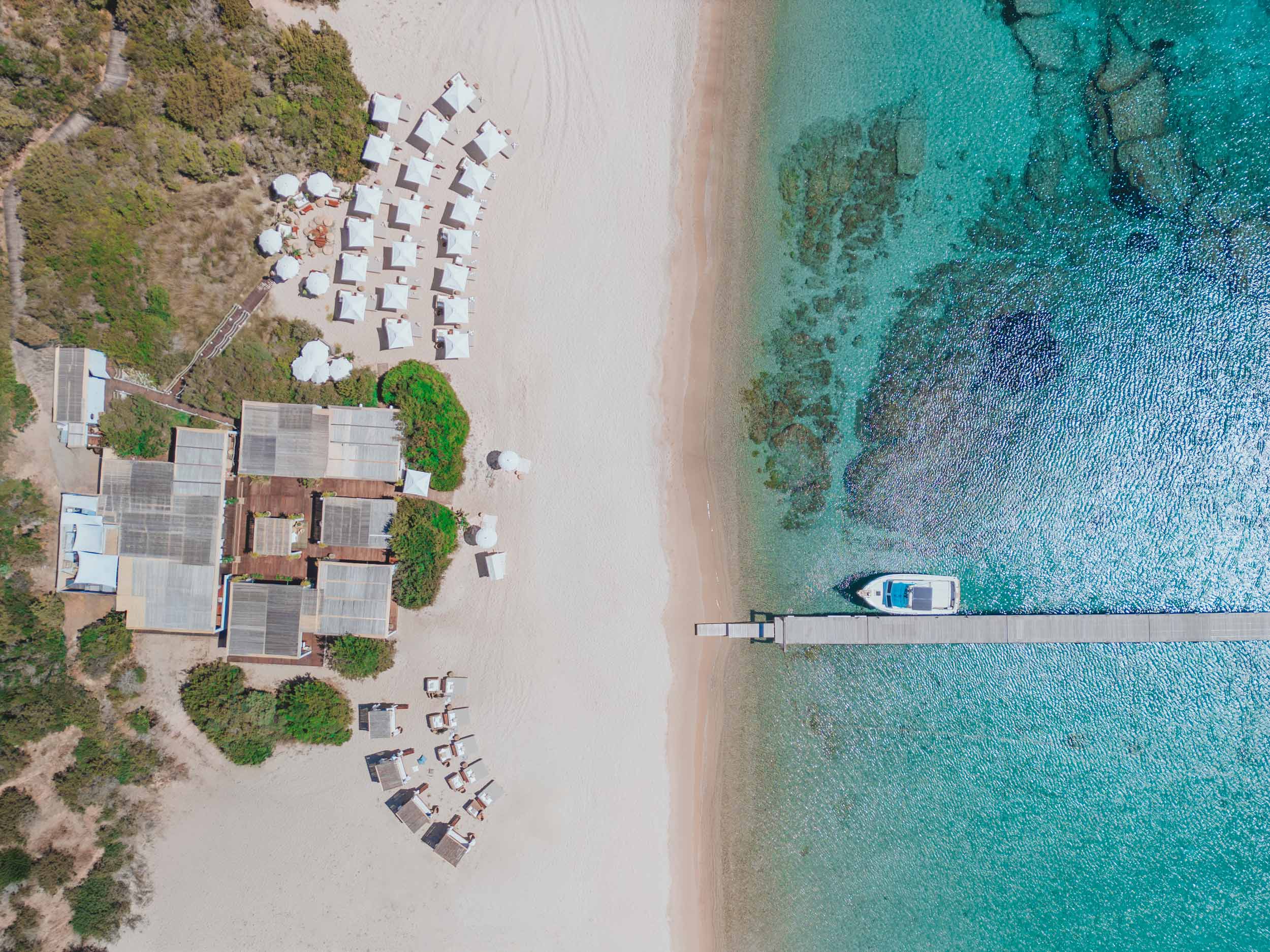 Ariel shot of Nikki Beach Montenegro showing the dining areas, pools, beach and boat docks