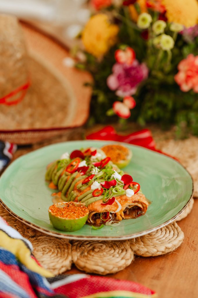 Close up of nikki beach dish garnished with chillies and lime