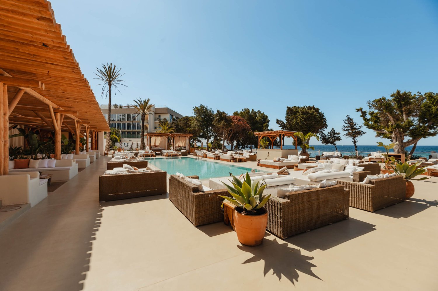 Nikki Beach Ibiza's Pool area with sun beds and sofas surrounding
