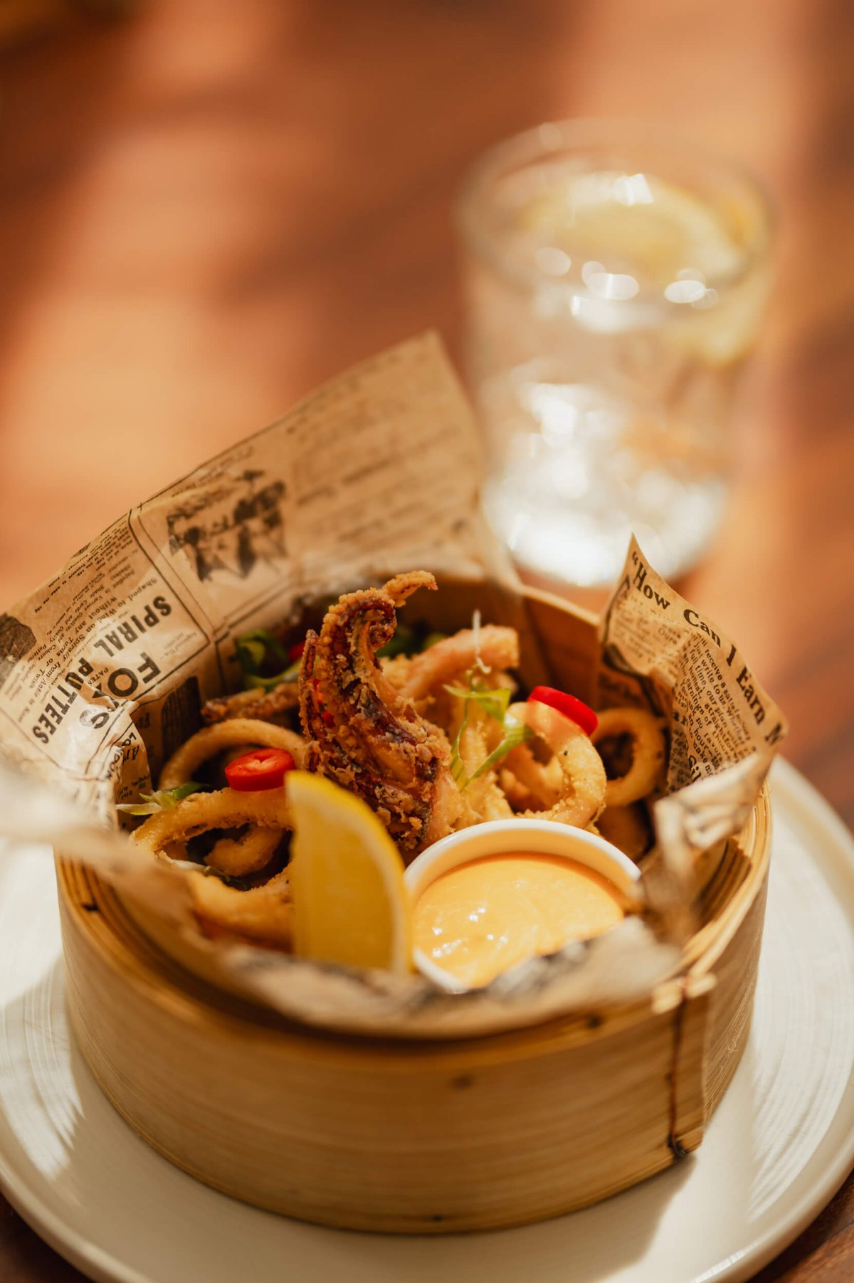 Fried seafood in a wooden serving bowl
