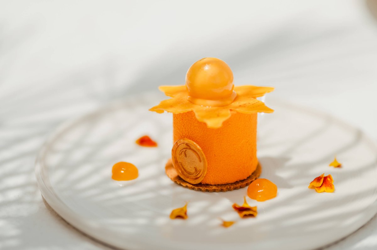Orange dessert on a white plate