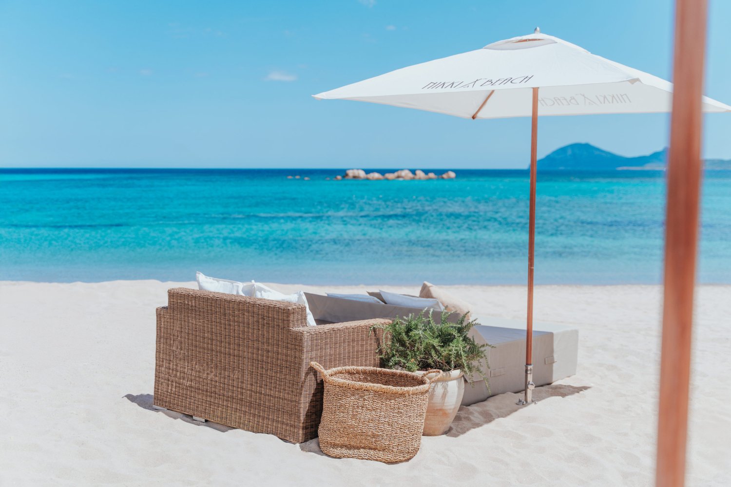 Beach with seating area and umbrella