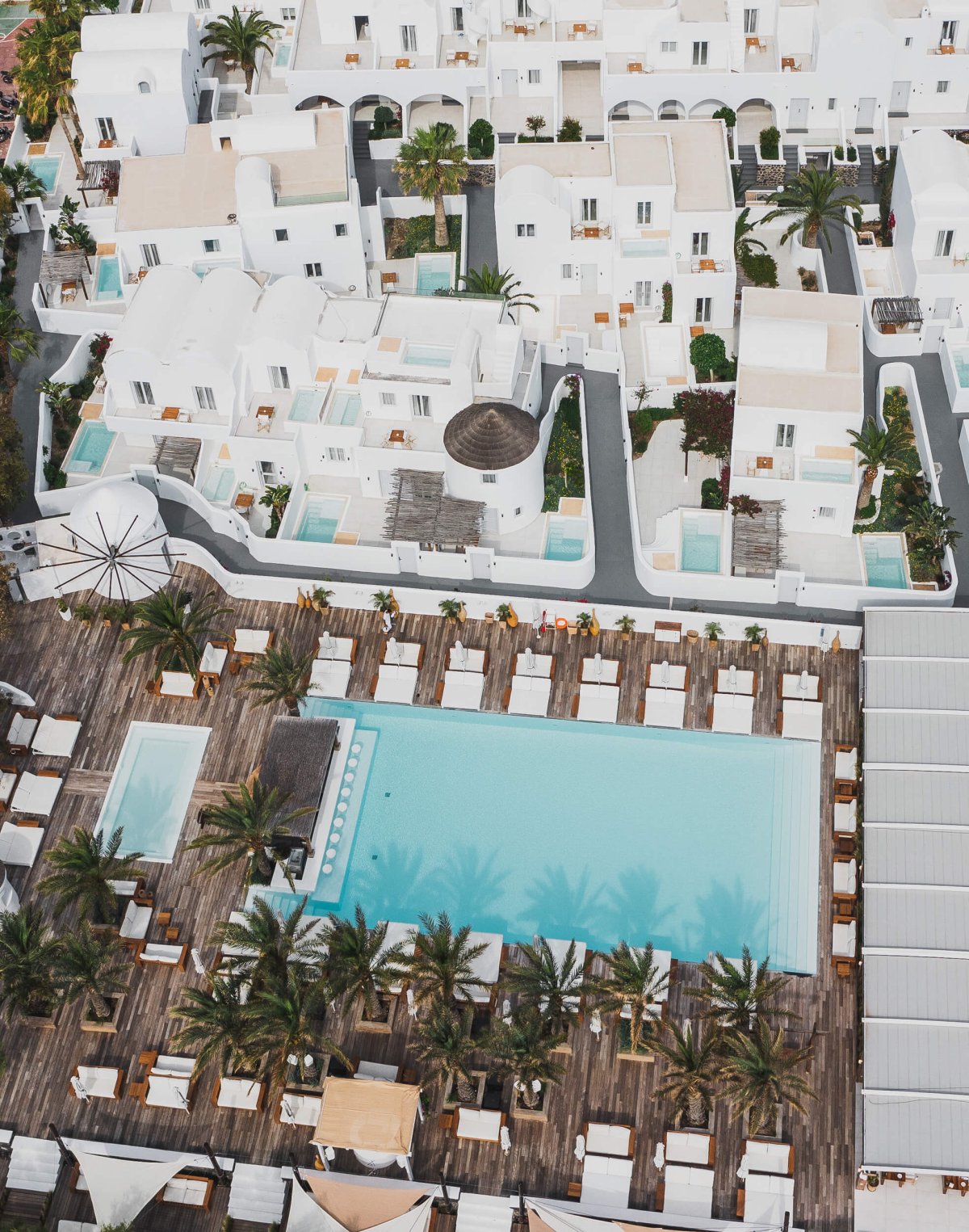 Drone shot of the resort pool and accommodation at Nikki Beach Santorini
